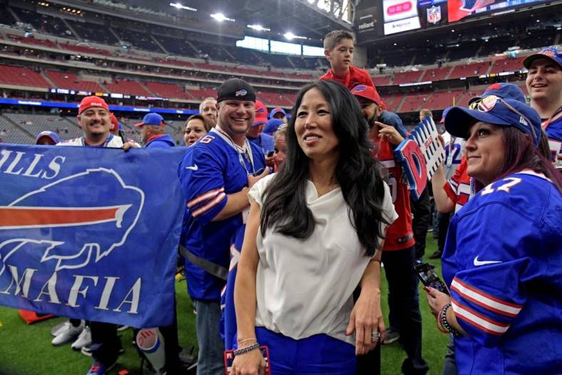 Jan 4, 2020; Houston, Texas, USA; Buffalo Bills owner Kim Pegula poses for pictured with fan before the AFC Wild Card NFL Playoff game against the Houston Texans at NRG Stadium. Mandatory Credit: Kirby Lee-USA TODAY Sports