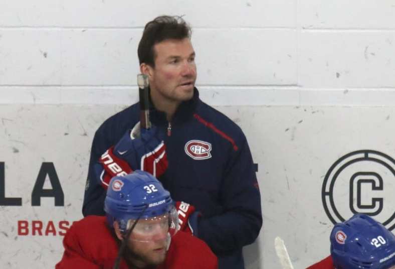 Jul 22, 2020; Montreal, Quebec, CANADA; Montreal Canadiens assistant coach Luke Richardson and defensemen Christian Folin (32) and Cale Fleury (20) watch the play during a NHL workout at Bell Sports Complex. Mandatory Credit: Jean-Yves Ahern-USA TODAY Sports