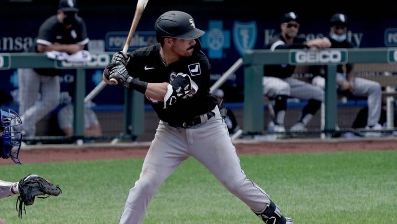 Aug 2, 2020; Kansas City, Missouri, USA;  Chicago White Sox shortstop Danny Mendick (20) at bat during the game against the Kansas City Royals at Kauffman Stadium. Mandatory Credit: Denny Medley-USA TODAY Sports