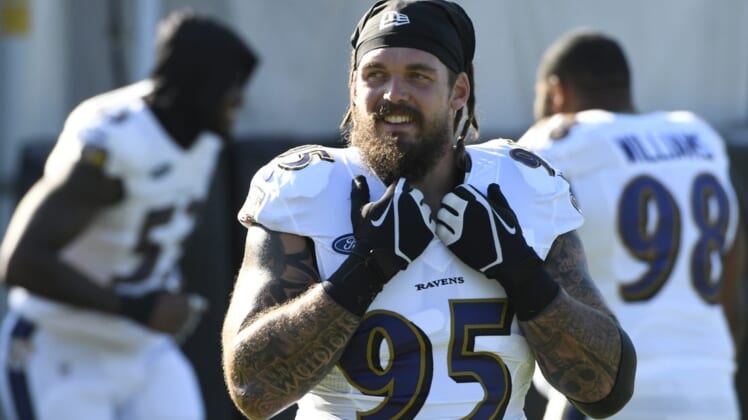 Aug 18, 2020; Owings Mills, Maryland, USA;  Baltimore Ravens defensive end Derek Wolfe (95) stands on the field during the morning session of training camp at Under Armour Performance Center. Mandatory Credit: Tommy Gilligan-USA TODAY Sports