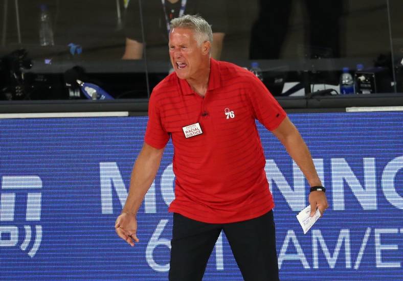 Aug 23, 2020; Lake Buena Vista, Florida, USA; Philadelphia 76ers head coach Brett Brown reacts after receiving a technical foul against the Boston Celtics during the third quarter in game four of an NBA basketball first-round playoff series at The Field House. Mandatory Credit: Kim Klement-USA TODAY Sports