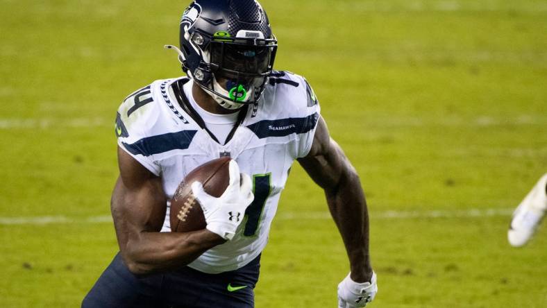 Seahawks' D.K. Metcalf (14) carries the ball against the Eagles Monday, Nov. 30, 2020 in Philadelphia.

Jl Eagles 113020 23