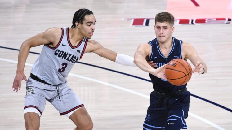Feb 20, 2021; Spokane, Washington, USA; Gonzaga Bulldogs guard Andrew Nembhard (3) reaches for the ball against San Diego Toreros guard Joey Calcaterra (2) in the first half at McCarthey Athletic Center. Mandatory Credit: James Snook-USA TODAY Sports
