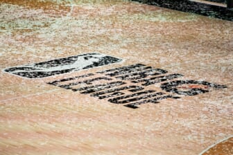 Mar 11, 2021; Orlando, Florida, USA; The NBA G League logo is covered in confetti after the Final between the Delaware Blue Coats and the Lakeland Magic at AdventHealth Arena. Mandatory Credit: Mary Holt-USA TODAY Sports