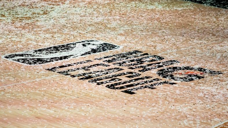 Mar 11, 2021; Orlando, Florida, USA; The NBA G League logo is covered in confetti after the Final between the Delaware Blue Coats and the Lakeland Magic at AdventHealth Arena. Mandatory Credit: Mary Holt-USA TODAY Sports