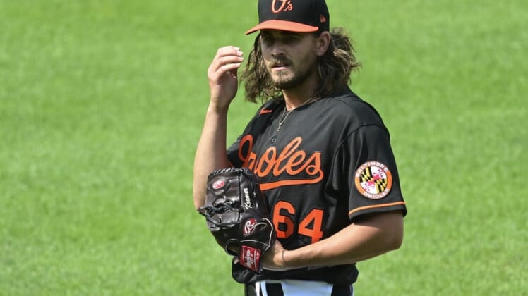 Jun 19, 2021; Baltimore, Maryland, USA;  Baltimore Orioles relief pitcher Dean Kremer (64) stands on the pitcher's mound during the first inning against the Toronto Blue Jays at Oriole Park at Camden Yards. Mandatory Credit: Tommy Gilligan-USA TODAY Sports
