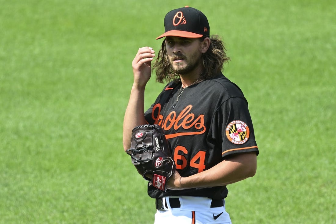 Jun 19, 2021; Baltimore, Maryland, USA;  Baltimore Orioles relief pitcher Dean Kremer (64) stands on the pitcher's mound during the first inning against the Toronto Blue Jays at Oriole Park at Camden Yards. Mandatory Credit: Tommy Gilligan-USA TODAY Sports