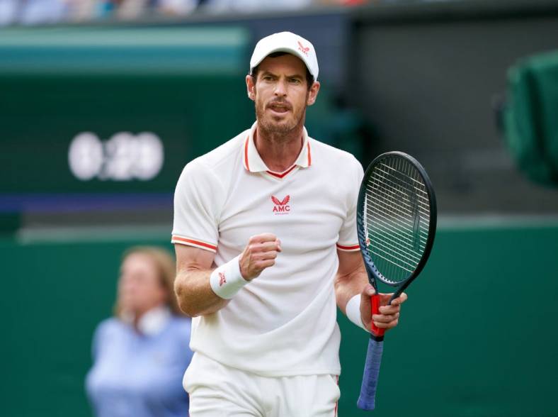 Jun 28, 2021; London, United Kingdom; Andy Murray (GBR) reacts against Nikoloz Basilashvili (GE) on the Centre Court in the first round at All England Lawn Tennis and Croquet Club. Mandatory Credit: Peter van den Berg-USA TODAY Sports