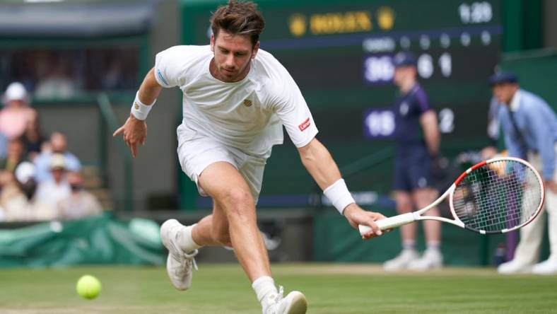 Jul 3, 2021; London, United Kingdom;  Cameron Norrie (GBR) plays Roger Federer (SUI)  on Centre Court in the men   s third round at All England Lawn Tennis and Croquet Club. Mandatory Credit: Peter van den Berg-USA TODAY Sports