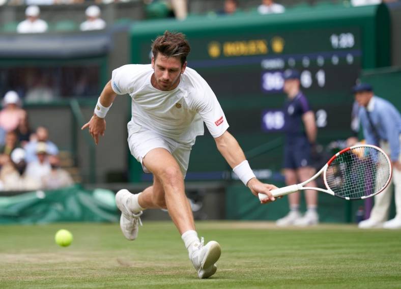 Jul 3, 2021; London, United Kingdom;  Cameron Norrie (GBR) plays Roger Federer (SUI)  on Centre Court in the men   s third round at All England Lawn Tennis and Croquet Club. Mandatory Credit: Peter van den Berg-USA TODAY Sports