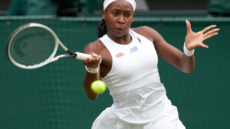 Jul 5, 2021; London, United Kingdom;  Coco Gauff (USA) seen playing Angelique Kerber (GER) on the Centre court in the ladies fourth round at All England Lawn Tennis and Croquet Club. Mandatory Credit: Peter van den Berg-USA TODAY Sports