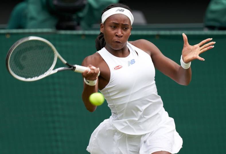 Jul 5, 2021; London, United Kingdom;  
Coco Gauff (USA) seen playing Angelique Kerber (GER) on the Centre court in the ladies fourth round at All England Lawn Tennis and Croquet Club. Mandatory Credit: Peter van den Berg-USA TODAY Sports
