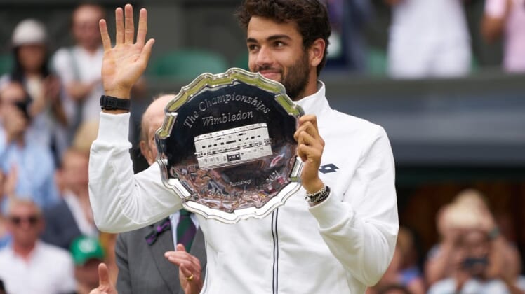 Jul 11, 2021; London, United Kingdom; Matteo Berrettini (ITA) with the runner-up trophy on Centre Court at All England Lawn Tennis and Croquet Club. Mandatory Credit: Peter van den Berg-USA TODAY Sports