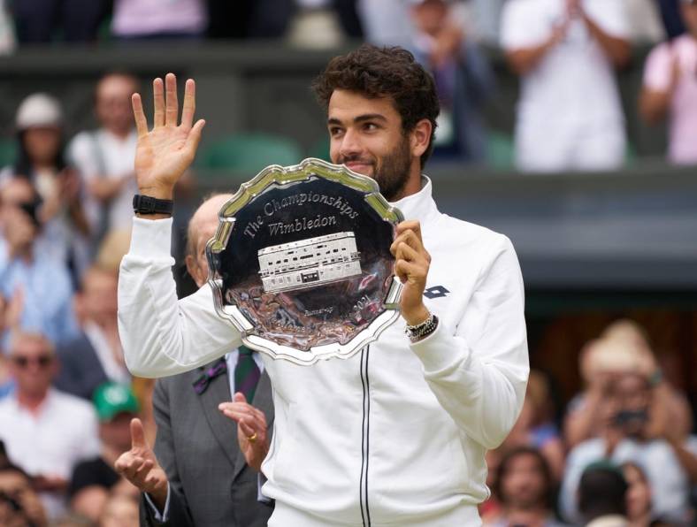 Jul 11, 2021; London, United Kingdom; Matteo Berrettini (ITA) with the runner-up trophy on Centre Court at All England Lawn Tennis and Croquet Club. Mandatory Credit: Peter van den Berg-USA TODAY Sports