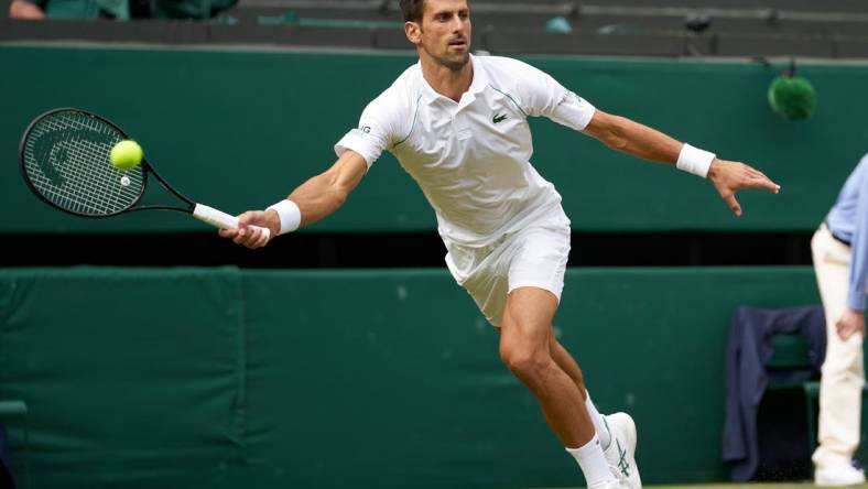 Jul 11, 2021; London, United Kingdom; Novak Djokovic (SRB) plays against Matteo Berrettini (ITA) in the men s final on Centre Court at All England Lawn Tennis and Croquet Club. Mandatory Credit: Peter van den Berg-USA TODAY Sports