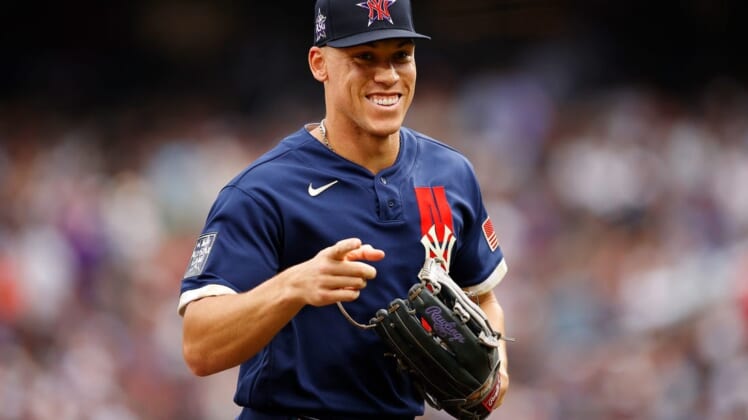 Jul 13, 2021; Denver, Colorado, USA; American League right fielder Aaron Judge of the New York Yankees (99) smiles and points as he runs back to the dugout after the second inning against the National League during the 2021 MLB All Star Game at Coors Field. Mandatory Credit: Isaiah J. Downing-USA TODAY Sports