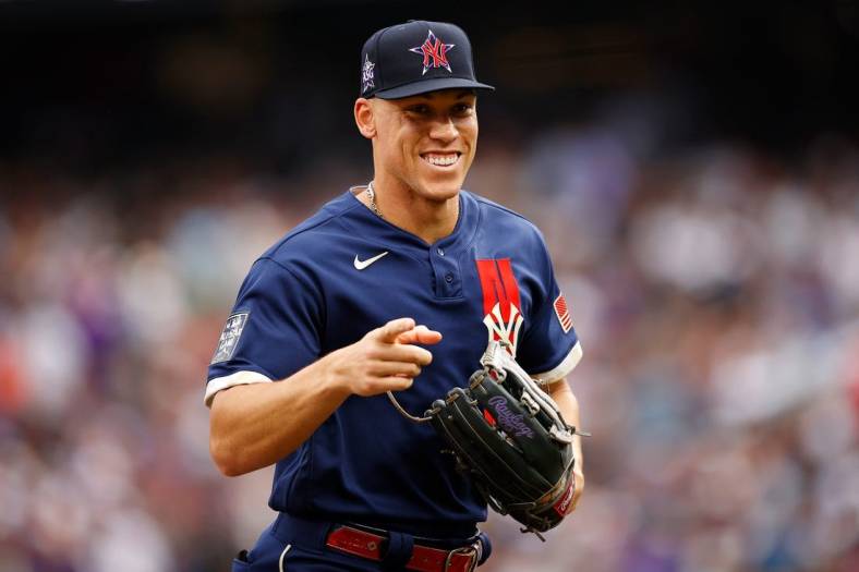 Jul 13, 2021; Denver, Colorado, USA; American League right fielder Aaron Judge of the New York Yankees (99) smiles and points as he runs back to the dugout after the second inning against the National League during the 2021 MLB All Star Game at Coors Field. Mandatory Credit: Isaiah J. Downing-USA TODAY Sports