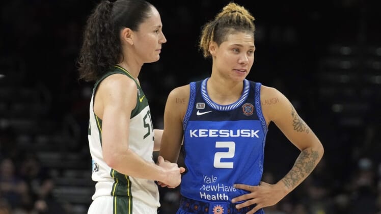 Aug 12, 2021; Phoenix, Arizona, USA; Seattle Storm guard Sue Bird (10) and Connecticut Sun guard Natisha Hiedeman (2) look on in the first half during the Inaugural WNBA Commissioners Cup Championship Game at Footprint Center. Mandatory Credit: Rick Scuteri-USA TODAY Sports