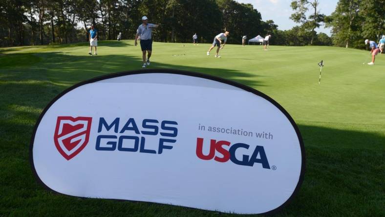 WEST YARMOUTH  8/25/21 Golfers warm up on the practice green at Bayberry Hills Golf Course which hosted a qualifier for the USGA Mid Amateur playing next month on Nantucket. Steve Heaslip/Cape Cod Times