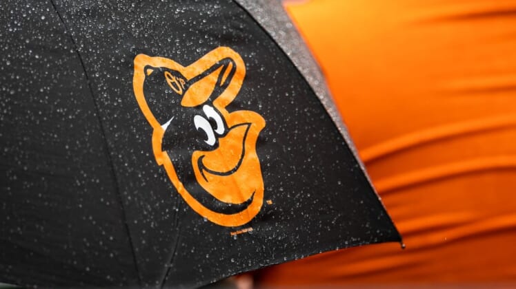 Aug 22, 2021; Baltimore, Maryland, USA; A Baltimore Orioles logo is seen on an umbrella during the game between the Baltimore Orioles and the Atlanta Braves at Oriole Park at Camden Yards. Mandatory Credit: Scott Taetsch-USA TODAY Sports