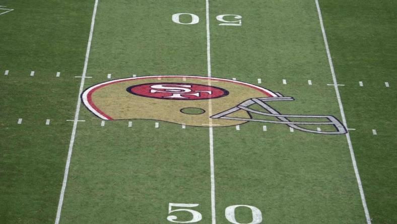 Aug 29, 2021; Santa Clara, California, USA; A detailed view of the San Francisco 49ers helmet logo at midfield at Levi's Stadium. Mandatory Credit: Kirby Lee-USA TODAY Sports