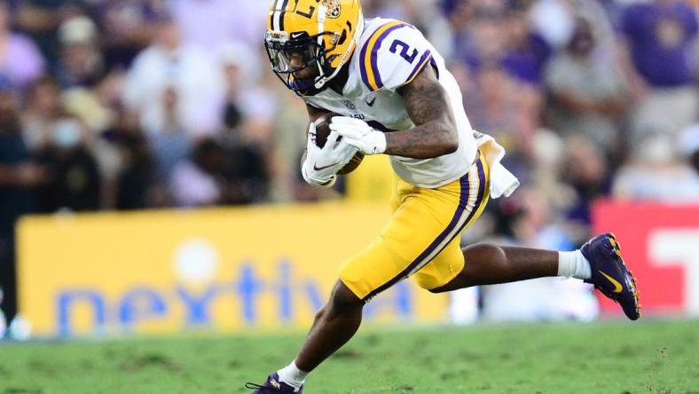 Sep 4, 2021; Pasadena, California, USA; Louisiana State Tigers wide receiver Koy Moore (2) runs the ball against the UCLA Bruins during the first half the at the Rose Bowl. Mandatory Credit: Gary A. Vasquez-USA TODAY Sports