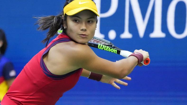 Sep 11, 2021; Flushing, NY, USA; Emma Raducanu of Great Britain hits a backhand against Leylah Fernandez of Canada (not pictured) in the women's singles final on day thirteen of the 2021 U.S. Open tennis tournament at USTA Billie Jean King National Tennis Center. Mandatory Credit: Robert Deutsch-USA TODAY Sports