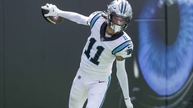 Sep 12, 2021; Charlotte, North Carolina, USA; Carolina Panthers wide receiver Robby Anderson (11) celebrates his touchdown reception from quarterback Sam Darnold (not pictured) against the New York Jets during the second quarter at Bank of America Stadium. Mandatory Credit: Jim Dedmon-USA TODAY Sports