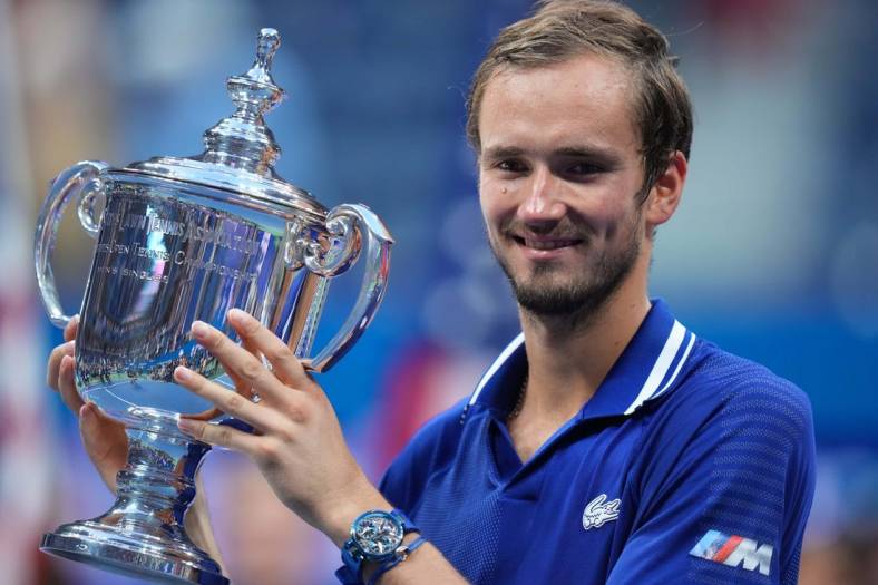 Sep 12, 2021; Flushing, NY, USA; Daniil Medvedev of Russia celebrates with the championship trophy after his match against Novak Djokovic of Serbia (not pictured) in the men's singles final on day fourteen of the 2021 U.S. Open tennis tournament at USTA Billie Jean King National Tennis Center. Mandatory Credit: Danielle Parhizkaran-USA TODAY Sports