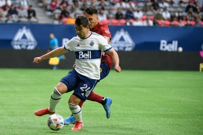 Aug 29, 2021; Vancouver, British Columbia, CAN;  Vancouver Whitecaps FC forward Brian White (24) controls the ball against Real Salt Lake defender Marcelo Silva (30) during the first half at BC Place. Mandatory Credit: Anne-Marie Sorvin-USA TODAY Sports