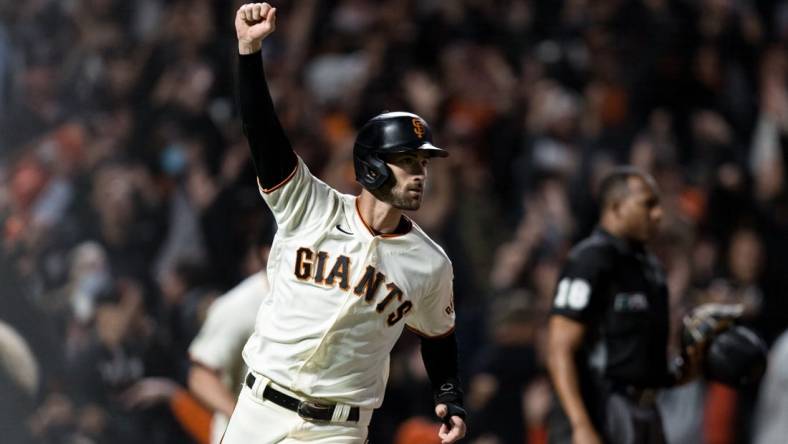 Sep 30, 2021; San Francisco, California, USA; San Francisco Giants center fielder Steven Duggar (6) reacts after center fielder LaMonte Wade Jr. (not seen) hit a bases-loaded RBI single for a walk-off win against the Arizona Diamondbacks in the ninth inning at Oracle Park. Mandatory Credit: John Hefti-USA TODAY Sports