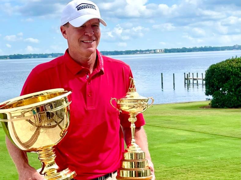 Steve Stricker displays the Presidents Cup (left) and the Ryder Cup after a news conference at the Timuquana Country Club on Thursday. Strickers is the third U.S. captain to have won both.

Stricker