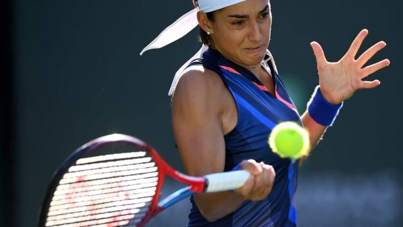 Oct 9, 2021; Indian Wells, CA, USA;  Caroline Garcia (FRA) hits a shot during her second round match against Cori  Coco  Gauff (USA) in the BNP Paribas Open at the Indian Wells Tennis Garden. Mandatory Credit: Jayne Kamin-Oncea-USA TODAY Sports