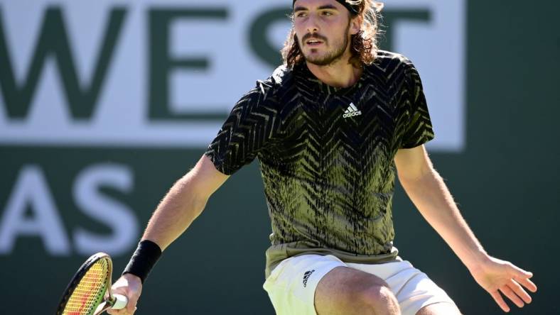 Oct 15, 2021; Indian Wells, CA, USA;   Stefanos Tsitsipas (GRE)hits a shot during his quarter final match against Nikoloz Basilashvili (GEO) during the BNP Paribas Open at the Indian Wells Tennis Garden. Mandatory Credit: Jayne Kamin-Oncea-USA TODAY Sports