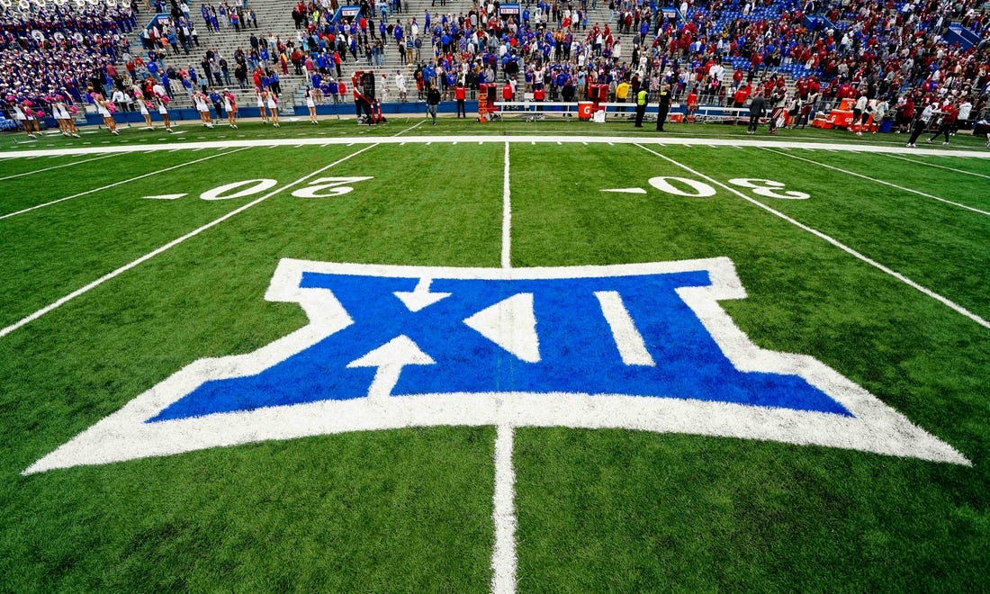 Oct 23, 2021; Lawrence, Kansas, USA; A general view of the Big 12 Conference logo on the field after the game between the Kansas Jayhawks and the Oklahoma Sooners at David Booth Kansas Memorial Stadium. Mandatory Credit: Jay Biggerstaff-USA TODAY Sports