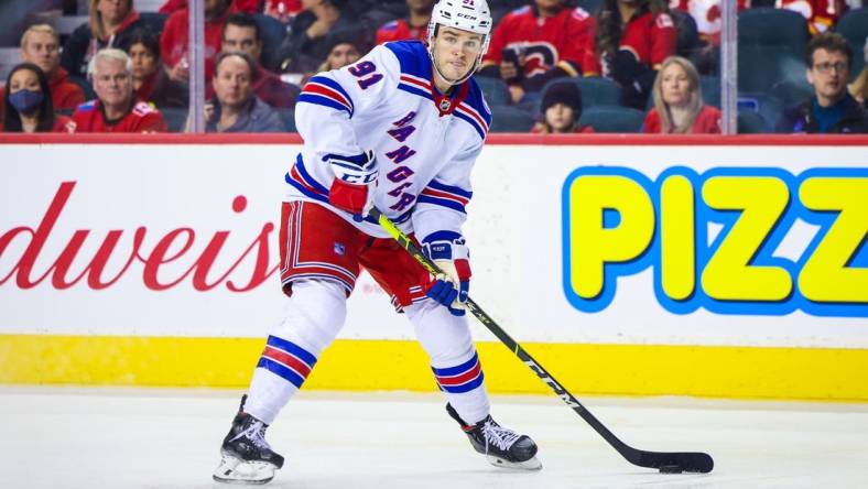 Nov 6, 2021; Calgary, Alberta, CAN; New York Rangers left wing Sammy Blais (91) controls the puck against the Calgary Flames during the second period at Scotiabank Saddledome. Mandatory Credit: Sergei Belski-USA TODAY Sports