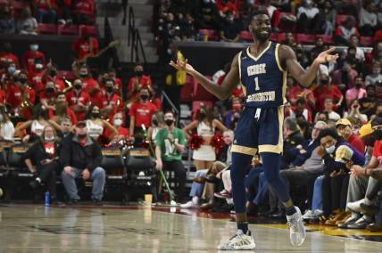 Nov 11, 2021; College Park, Maryland, USA;  George Washington Colonials guard Joe Bamisile (1) reacts to spectators during the game against the Maryland Terrapins at Xfinity Center. Mandatory Credit: Tommy Gilligan-USA TODAY Sports