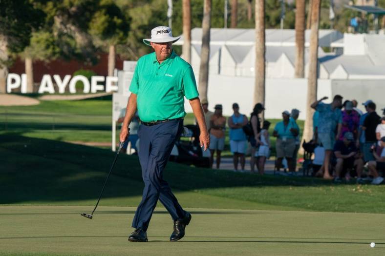 Nov 13, 2021; Phoenix, Arizona, USA; Kirk Triplett lines up a putt on the 18th hole during the third round of the Charles Schwab Cup Championship golf tournament at Phoenix Country Club. Mandatory Credit: Allan Henry-USA TODAY Sports