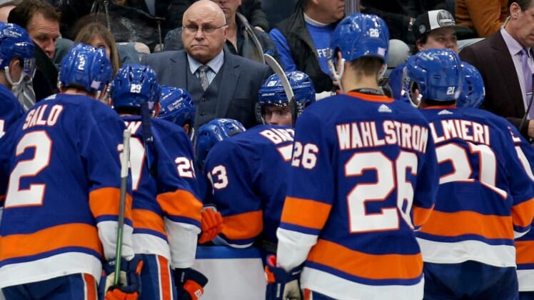 Nov 20, 2021; Elmont, New York, USA; New York Islanders head coach Barry Trotz talks to his team during a time out during the third period against the Calgary Flames at UBS Arena. Mandatory Credit: Brad Penner-USA TODAY Sports