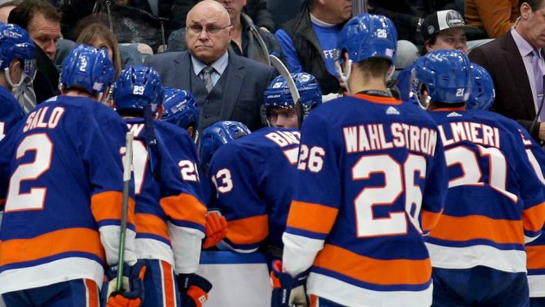 Nov 20, 2021; Elmont, New York, USA; New York Islanders head coach Barry Trotz talks to his team during a time out during the third period against the Calgary Flames at UBS Arena. Mandatory Credit: Brad Penner-USA TODAY Sports