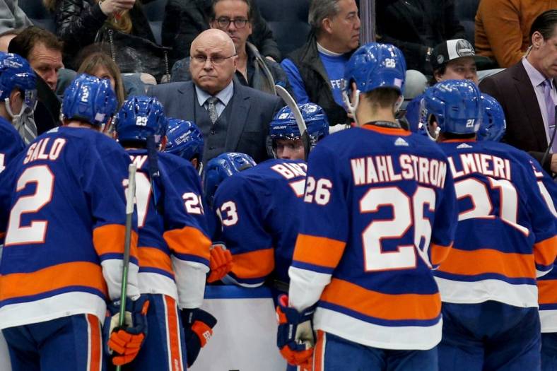 Nov 20, 2021; Elmont, New York, USA; New York Islanders head coach Barry Trotz talks to his team during a time out during the third period against the Calgary Flames at UBS Arena. Mandatory Credit: Brad Penner-USA TODAY Sports
