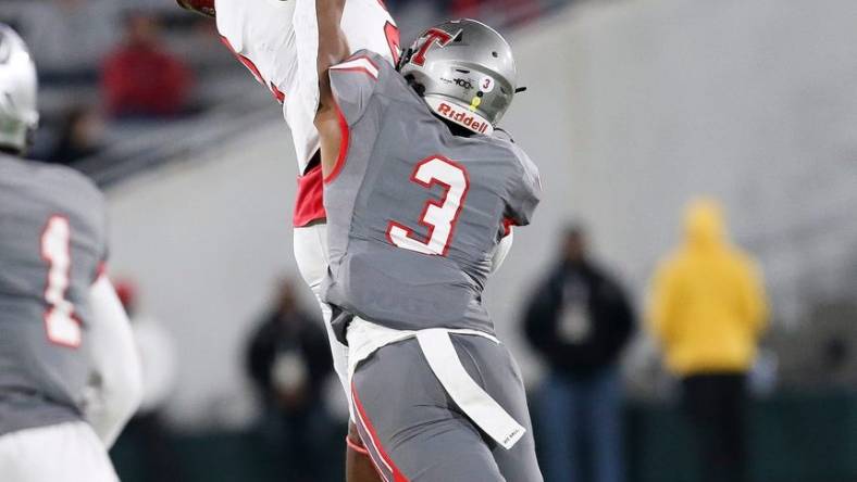 Thompson defensive back Tony Mitchell (3) breaks up a pass intended for Central wide receiver Karmello English (2) during the 7A state championship game in Birmingham Wednesday, Dec. 1, 2021. [Staff Photo/Gary Cosby Jr]

7a Championship Central Vs Thompson