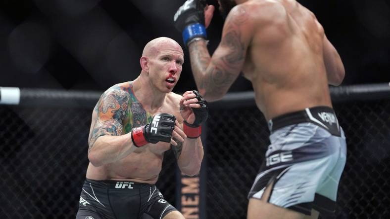 Dec 11, 2021; Las Vegas, Nevada, USA; Josh Emmett fights against Dan Ige during UFC 269 at T-Mobile Arena. Mandatory Credit: Stephen R. Sylvanie-USA TODAY Sports