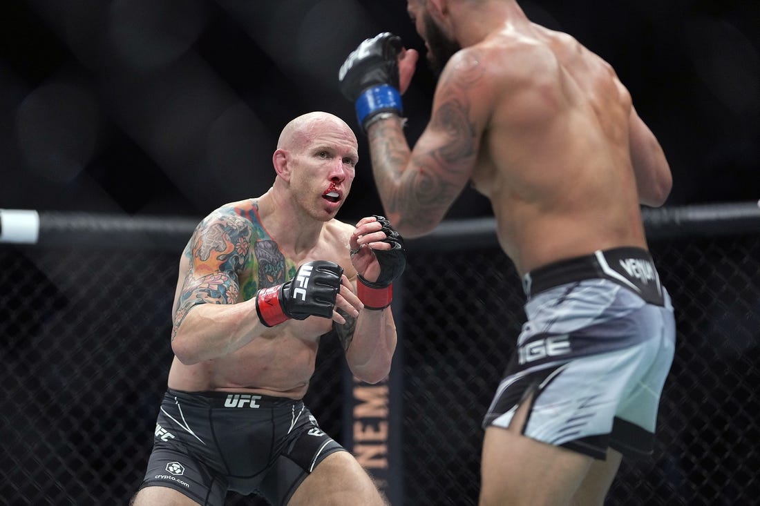 Dec 11, 2021; Las Vegas, Nevada, USA; Josh Emmett fights against Dan Ige during UFC 269 at T-Mobile Arena. Mandatory Credit: Stephen R. Sylvanie-USA TODAY Sports