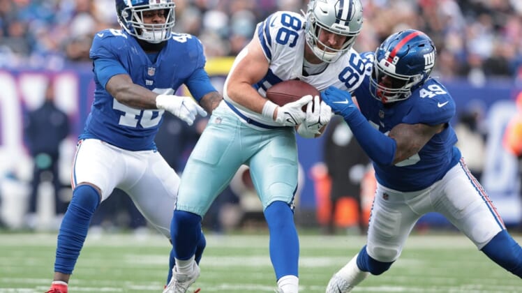 Dec 19, 2021; East Rutherford, New Jersey, USA; Dallas Cowboys tight end Dalton Schultz (86) is tackled by New York Giants inside linebacker Benardrick McKinney (49) and inside linebacker Tae Crowder (48) after a catch during the first half at MetLife Stadium. Mandatory Credit: Vincent Carchietta-USA TODAY Sports
