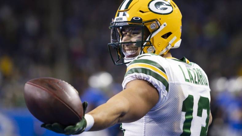 Jan 9, 2022; Detroit, Michigan, USA; Green Bay Packers wide receiver Allen Lazard (13) reacts after making a touchdown catch during the second quarter against the Detroit Lions at Ford Field. Mandatory Credit: Raj Mehta-USA TODAY Sports