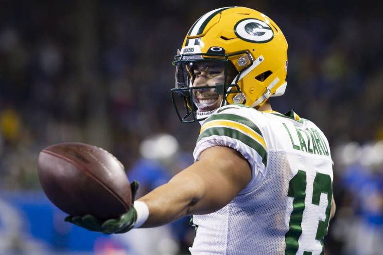 Jan 9, 2022; Detroit, Michigan, USA; Green Bay Packers wide receiver Allen Lazard (13) reacts after making a touchdown catch during the second quarter against the Detroit Lions at Ford Field. Mandatory Credit: Raj Mehta-USA TODAY Sports
