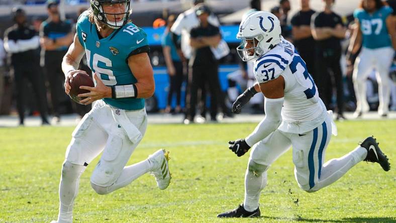 Indianapolis Colts safety Khari Willis (37) pressures Jacksonville Jaguars quarterback Trevor Lawrence (16) who scrambles and throws a touchdown pass to wide receiver Marvin Jones (11)  during the third quarter of the game on Sunday, Jan. 9, 2022, at TIAA Bank Field in Jacksonville, Fla.

The Indianapolis Colts Versus Jacksonville Jaguars On Sunday Jan 9 2022 Tiaa Bank Field In Jacksonville Fla