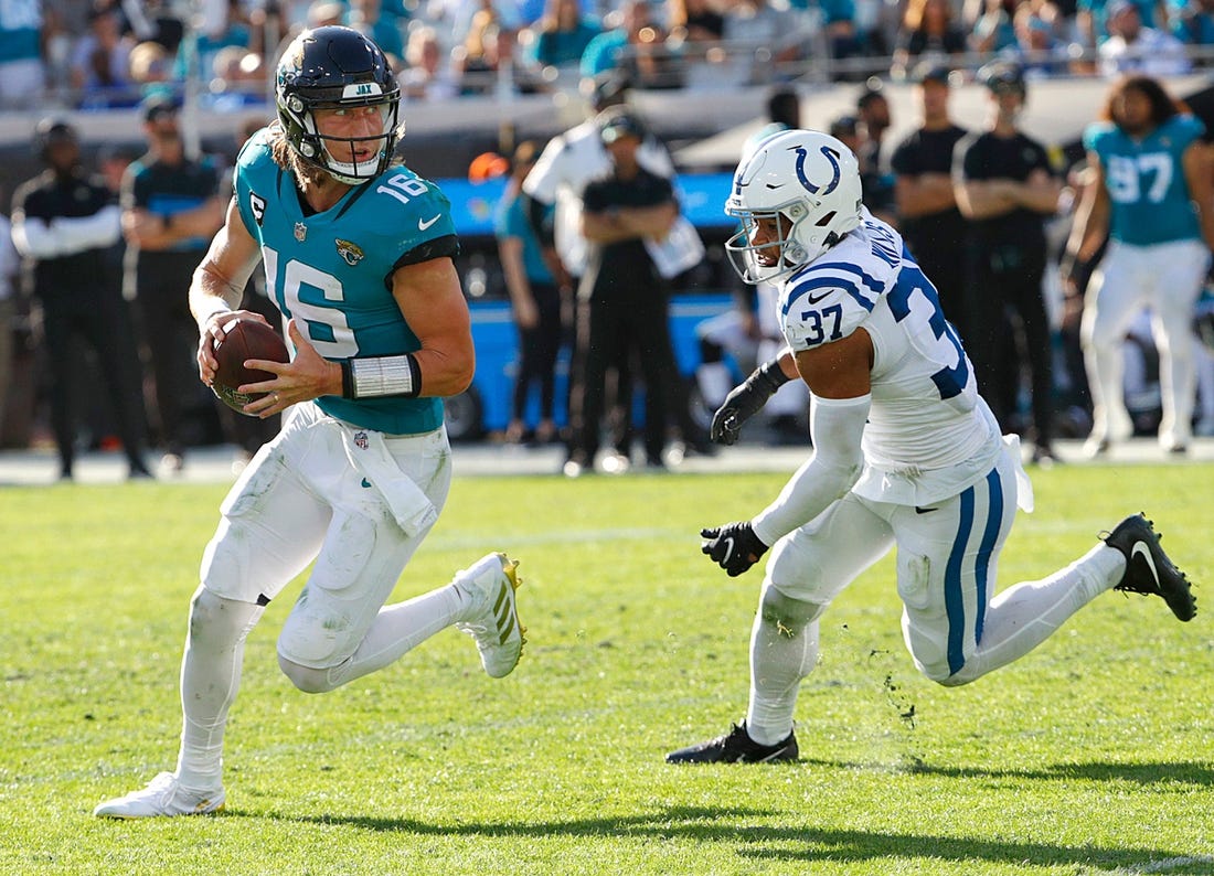 Indianapolis Colts safety Khari Willis (37) pressures Jacksonville Jaguars quarterback Trevor Lawrence (16) who scrambles and throws a touchdown pass to wide receiver Marvin Jones (11)  during the third quarter of the game on Sunday, Jan. 9, 2022, at TIAA Bank Field in Jacksonville, Fla.

The Indianapolis Colts Versus Jacksonville Jaguars On Sunday Jan 9 2022 Tiaa Bank Field In Jacksonville Fla