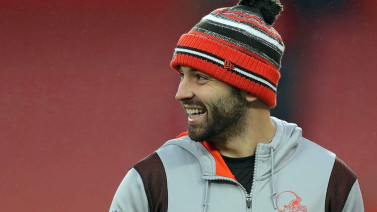 Browns quarterback Baker Mayfield laughs as he watches his teammates warm up before a game against the Cincinnati Bengals, Sunday, Jan. 9, 2022, in Cleveland.Baker Pregame 2